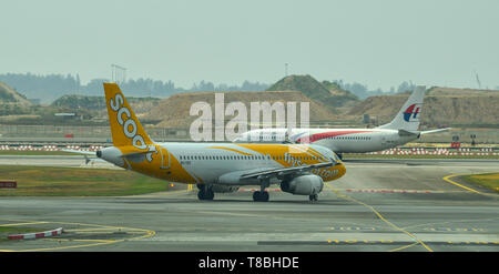 Singapore - Mar 28, 2019. 9V-TRO Scoot Airbus A320 taxiing on runway of Singapore Changi Airport (SIN). Stock Photo