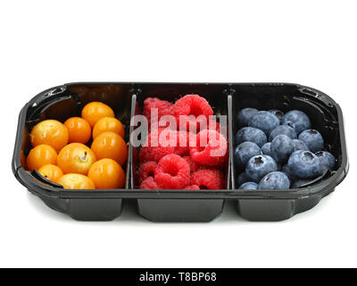 raspberries, blueberries and berries of physalis in black container isolated on white background Stock Photo