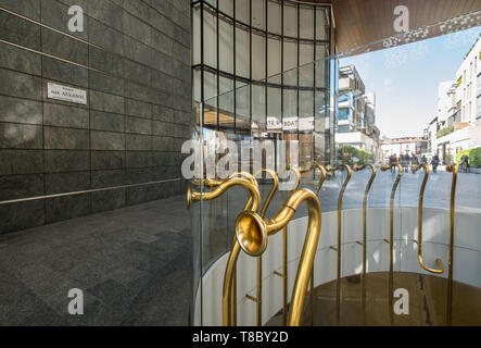 Piazza Gae Aulenti, part of Milan's Porta Nuova regeneration project, featuring modern architecture and shopping. Stock Photo
