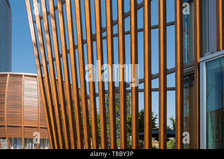 Modern architecture with wooden cladding at Piazza Gae Aulenti, part of Milan's Porta Nuova regeneration project. Stock Photo