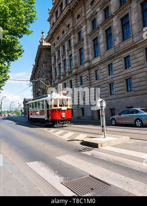 Trams along the River Vltava promenade in Prague in the Czech Republic Stock Photo