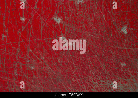 Scratch on the surface of the red desk Stock Photo