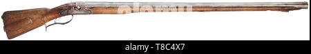 A heavy percussion wall rifle, barrel dated 1663 Slightly swamped, seven-groove rifled bore, long octagonal barrel in 20 mm calibre with dovetailed brass front sight. At the muzzle and in front of the (missing) rear sight embossed geometrical design. The top of the barrel bearing the date '1663' ('1763' struck on top), on the left at the end of the barrel the smith mark of Wenzel Kutschera (Stöckel no. 675). Converted percussion lock with illegible inscription and defect hair trigger. Walnut full stock with patch-box and ornamentally engraved bra, Additional-Rights-Clearance-Info-Not-Available Stock Photo