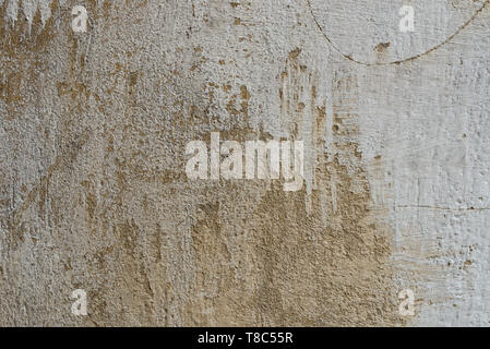 old obsolete beige color plastered wall background texture Stock Photo