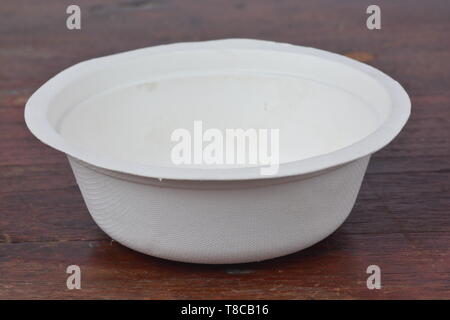 Disposable bowl on wood background Stock Photo