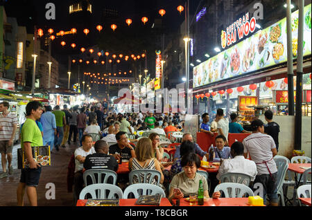 Outdoor food restaurants on crowded street Jalan Alor located in Bukit Bintang, Kuala Lumpur, Malaysia Stock Photo