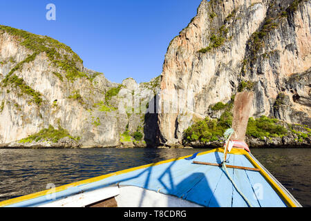 (Selective focus) Stunning view of some limestone rock mountains surrounding the beautiful Maya Bay. Photo taken from a traditional long tail boat.