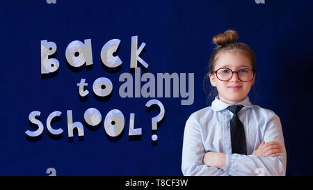 Back to school horizontal banner. Elementary grade schoolgirl in spectacles. Chalk style lettering with question mark. Positive elementary grade pupil. School education, knowledge gaining poster Stock Photo