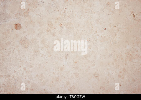 Abstract blank solid background smooth polished stone surface, which is most likely made of limestone tuff and suitable for layouts Stock Photo