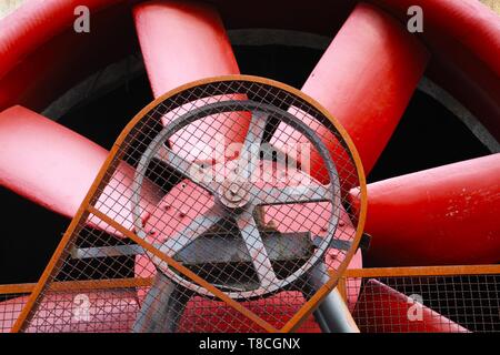 Landschaftspark Duisburg, Germany: Close up of red turbine with driving belt and rusty steel wall Stock Photo