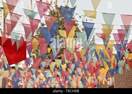 Colorful festive decoration-pennant garlands or buntings. Street in Hotan-Xinjiag-China-0130 Stock Photo