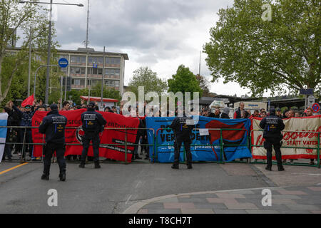 Pforzheim, Germany. 11th May, 2019. Police officers watch the counter protest. Around 80 people participated in a march through Pforzheim, organised by the right-wing party ‘Die Rechte' (The Right). The main issues of the march was the promotion of voting for Die Rechte' in the upcoming European Election and their anti-immigration policies. They were confronted by several hundred counter-protesters from different political organisations. Credit: Michael Debets/Pacific Press/Alamy Live News Stock Photo