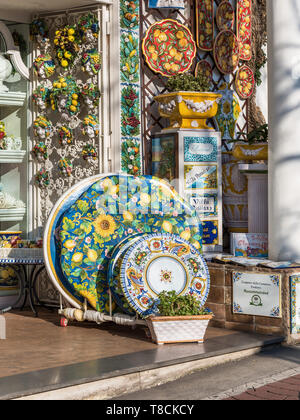 Intricate hand-painted ceramic plates and pottery on display outside a boutique shop in Positano, Amalfi Coast, Italy. Traditional local crafts Stock Photo