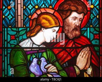 Stained glass window by Henry Holiday 1863 Shimpling church, Suffolk, England, UK Pre-Raphaelite artist - Mary and Joseph Stock Photo