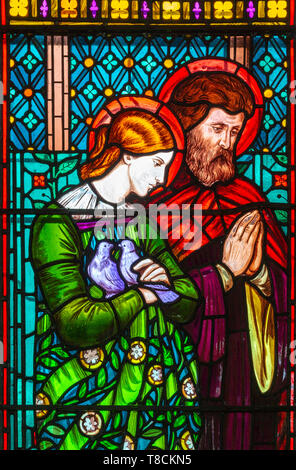 Stained glass window by Henry Holiday 1863 Shimpling church, Suffolk, England, UK Pre-Raphaelite artist - Mary and Joseph Stock Photo