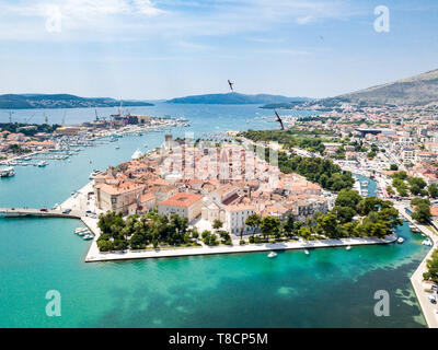 Aerial view of touristic old Trogir, historic town on a small island and harbour on the Adriatic coast in Split-Dalmatia County, Croatia. Flock of gul Stock Photo