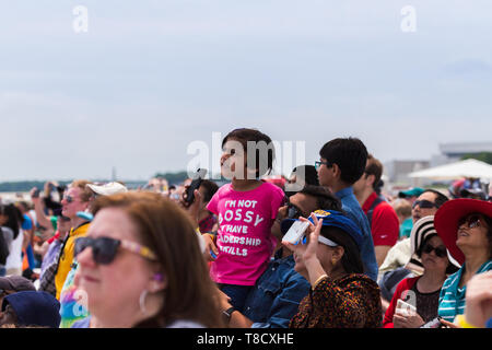 A packed crowd at JBA air force base outside Washington, DC watch the US Air Force Thunderbirds perform overhead. Stock Photo