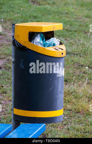 A garbage bin near the Walensee in Walenstadt nearly filled with garbage. Switzerland. Stock Photo