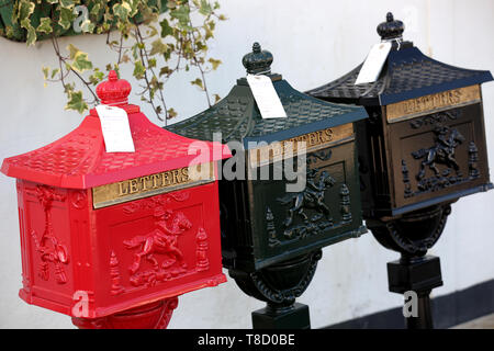 Three metal postboxes pictured for sale in Bognor Regis, West Sussex, UK. Stock Photo