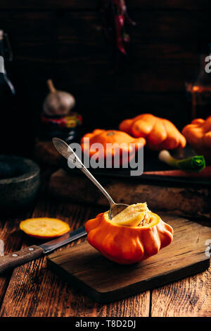 Yellow pattypan squash prepared for stuffing with minced meat Stock Photo
