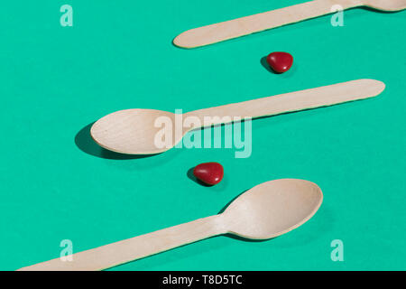 spoons and pillson the blue table, close up photo Stock Photo