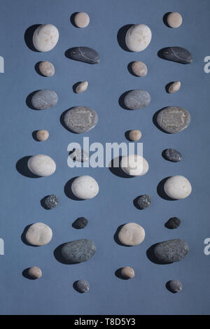 ground stones isolated on the blue background, top view photo Stock Photo