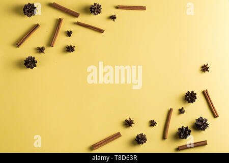 interesting creative composition of spice on the yellow table. copy space, place for text. Stock Photo