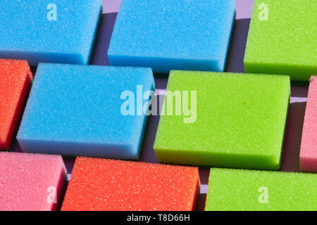 collection of sponges for washing the dishes, top view photo. house cleaning, business. Montessori's games Stock Photo