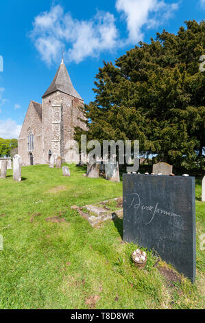 Derek Jarman's grave in the churchyard of St Clement's church, Old Romney on Romney Marsh. Stock Photo
