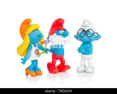 The Smurfs - Smurfette, Pappa Smurf and Brainy toys isolated on white background with shadow reflection. Smurfs toy figure model character from The Sm Stock Photo