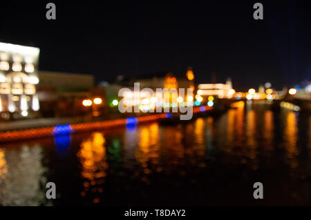 Abstract city lights background. Defocused urban background at night. Abstract city neon lights at night Stock Photo