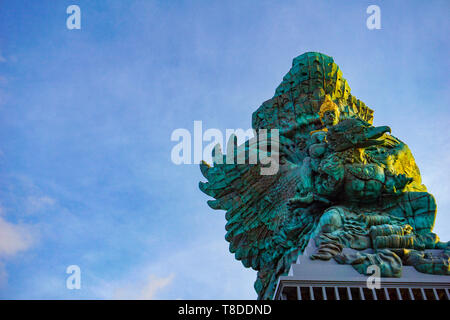 Picture of Garuda statue as Bali landmark with blue sky as a background. Balinese traditional symbol of hindu religion Stock Photo