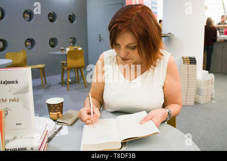 Czech author Alena Mornstajnova signs her books at the 25th International Book Fair and Literary Festival Book World Prague 2019, Czech Republic, May Stock Photo