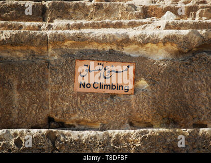 Sign of no climbing at the base of the great pyramid of Cheops in Cairo, egypt Stock Photo