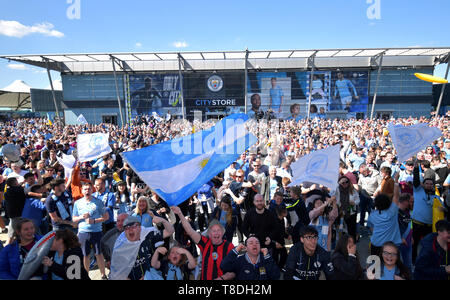Manchester City fans celebrate at the Etihad Stadium, Manchester. Stock Photo