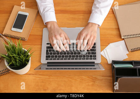 Real estate agent using laptop in office Stock Photo