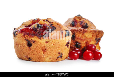 Sweet tasty muffins with cranberry on white background Stock Photo