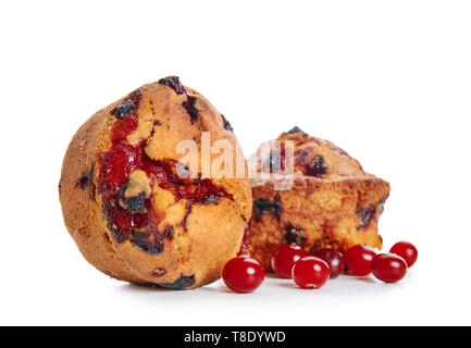Sweet tasty muffins with cranberry on white background Stock Photo