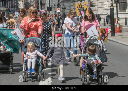 London, UK. 12th May, 2019. Thousands of parents, accompanied with children  and their families marched  in central London to demand urgent action to tackle climate change after British health secretary Matt Hancock named “dirty air” as the “largest environmental risk to public health in the UK” and warned of a growing national health emergency triggered by the “slow and deadly poison” of air pollution. Credit: amer ghazzal/Alamy Live News Stock Photo