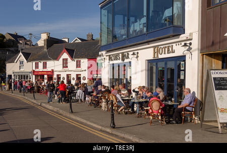 Baltimore, Ireland, 12th May 2019, The annual Fiddle Fair in Baltimore brought out the crowds to enjoy the music on a fine summers evening, enjoying a drink and a meal as the sun set over the harbour. Credit aphperspective/ Alamy Live News Stock Photo