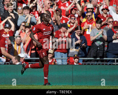 Liverpool. 13th May, 2019. Liverpool's Sadio Mane celebrates scoring during the final English Premier League match of the season between Liverpool and Wolverhampton Wanderers at Anfield in Liverpool, Britain on May 12, 2019. Liverpool won 2-0. Credit: Xinhua/Alamy Live News Stock Photo