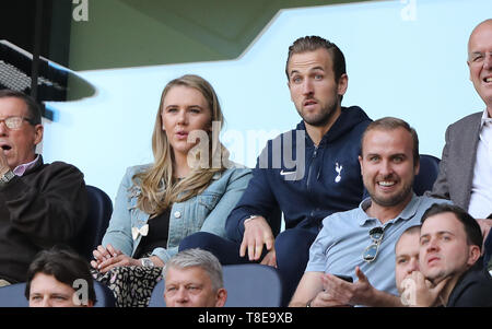 London, UK. 12th May, 2019. Harry Kane (TH) watches the game from the stands with his partner Katie Goodland, at the Tottenham Hotspur v Everton English Premier League match, at The Tottenham Hotspur Stadium, London, UK on May 12, 2019. **Editorial use only, license required for commercial use. No use in betting, games or a single club/league/player publications** Credit: Paul Marriott/Alamy Live News Stock Photo