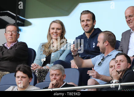 London, UK. 12th May, 2019. Harry Kane (TH) watches the game from the stands with his partner Katie Goodland, at the Tottenham Hotspur v Everton English Premier League match, at The Tottenham Hotspur Stadium, London, UK on May 12, 2019. **Editorial use only, license required for commercial use. No use in betting, games or a single club/league/player publications** Credit: Paul Marriott/Alamy Live News Stock Photo