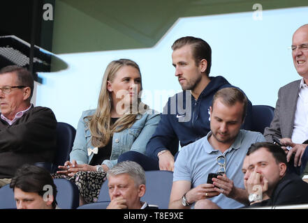 London, UK. 12th May, 2019. Harry Kane (TH) watches the game from the stands with his partner Katie Goodland, at the Tottenham Hotspur v Everton English Premier League match, at The Tottenham Hotspur Stadium, London, UK on May 12, 2019. **Editorial use only, license required for commercial use. No use in betting, games or a single club/league/player publications** Credit: Paul Marriott/Alamy Live News Stock Photo