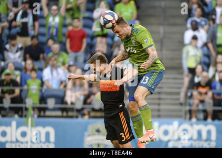 Seattle, Washington, USA. 11th May, 2019. Adam Lundkvist (8) challenges Seattle foward Jordan Morris (13) as the Houston Dynamo visits the Seattle Sounders in a MLS match at Century Link Field in Seattle, WA. Seattle won the match 1-0 on a 1st half Morris goal. Credit: Jeff Halstead/ZUMA Wire/Alamy Live News Stock Photo