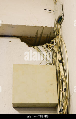 tangled network cables and wires in server room Stock Photo