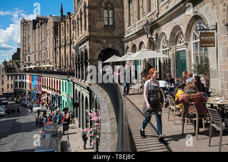 Scotts Kitchen on Victoria Terrace looking down on the colourful shops on Victoria Street in Edinburgh's Old Town. Stock Photo