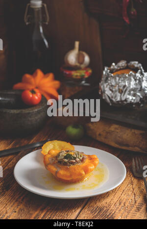 Baked pattypan squash filled with meat and vegetables Stock Photo