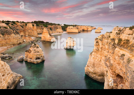 Amazing sunset at Marinha Beach in the Algarve, Portugal. Landscape with strong colors of one of the main holiday destinations in europe. Summer touri