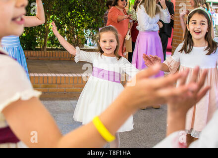 Murcia, Spain, May 12, 2019: Birthday party with friends. Little girls celebrate special dates. Familiar gather in communion. Child, children, kid, kids. Stock Photo